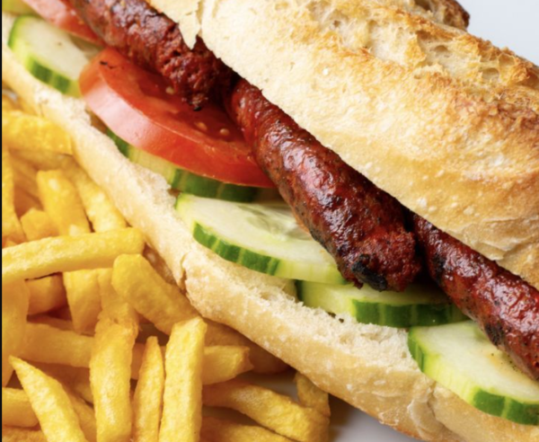 Image d'un burger savoureux de Munchies73 à La Tronche, garni d'ingrédients frais et de qualité, prêt à être dégusté.